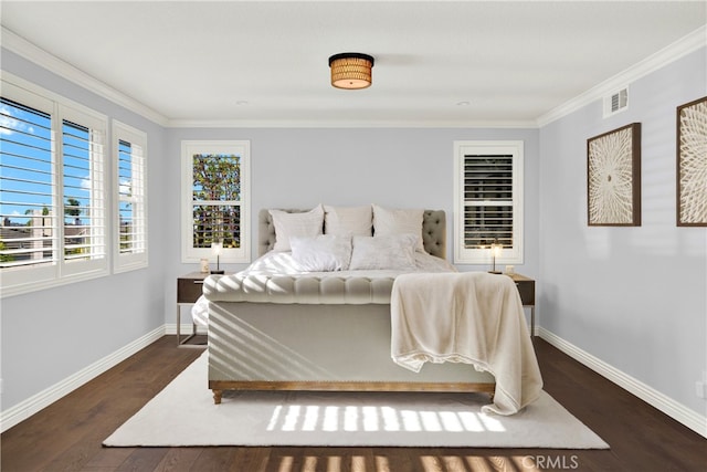 bedroom featuring ornamental molding, visible vents, dark wood finished floors, and baseboards