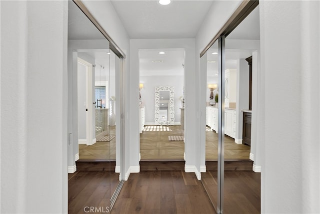 hallway featuring dark hardwood / wood-style floors