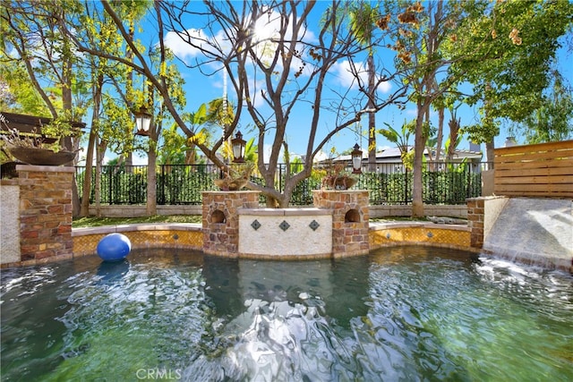 view of pool featuring pool water feature