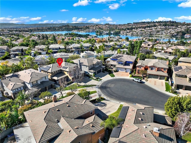 bird's eye view featuring a water view and a residential view