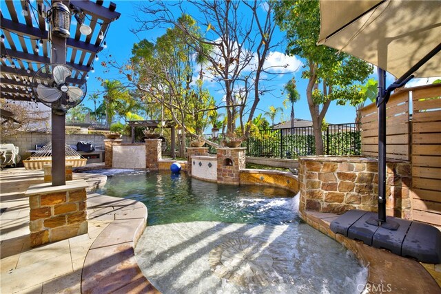 view of patio featuring pool water feature, a fenced in pool, and a pergola