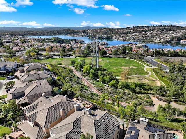 drone / aerial view with a residential view and a water view