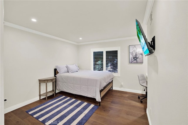 bedroom with dark hardwood / wood-style floors and crown molding