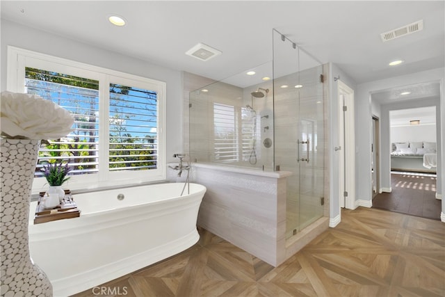 full bath with recessed lighting, a soaking tub, visible vents, and a shower stall