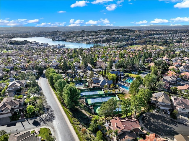 drone / aerial view featuring a water view and a residential view