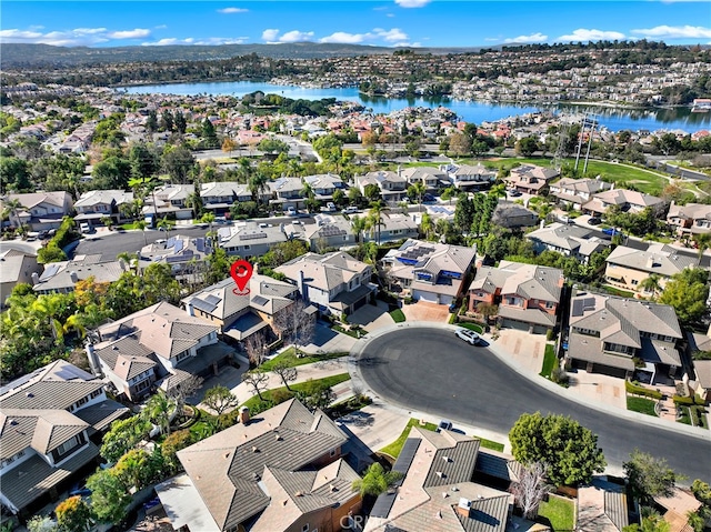 bird's eye view with a water view and a residential view