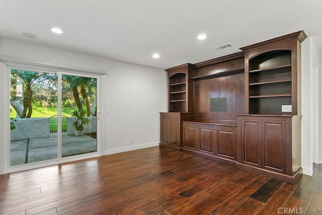 unfurnished living room with dark hardwood / wood-style flooring