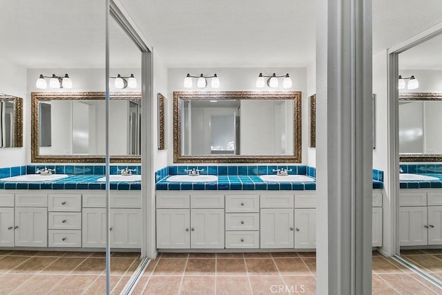 bathroom featuring tile patterned floors and vanity