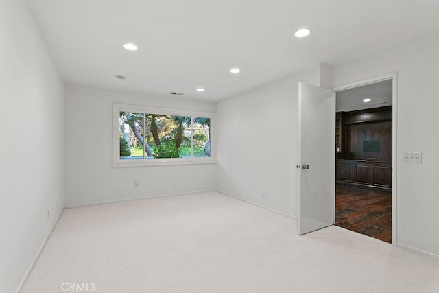 unfurnished room featuring carpet floors