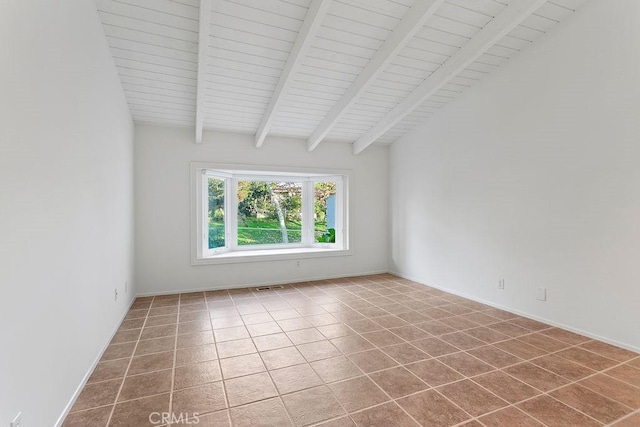 tiled empty room with beam ceiling