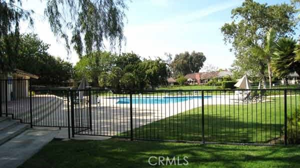 view of pool featuring a patio area and a lawn