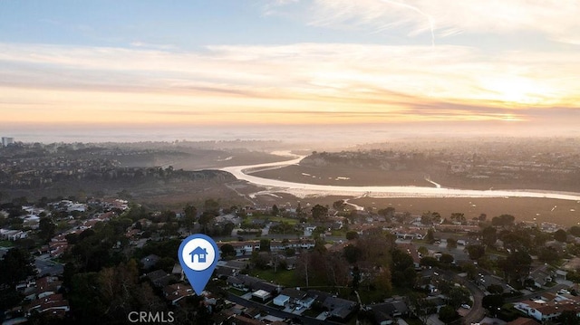 aerial view at dusk with a water view