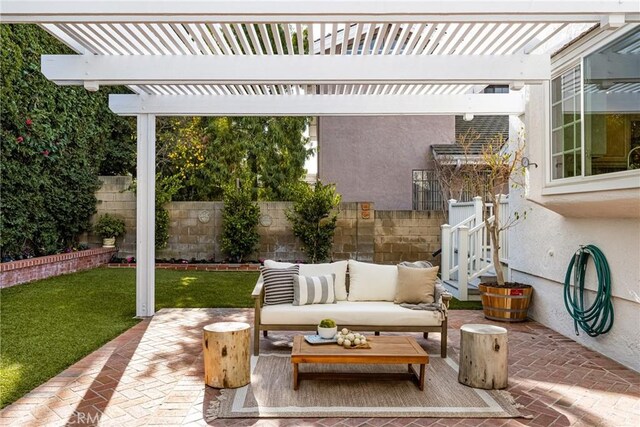 view of patio / terrace with a pergola and outdoor lounge area