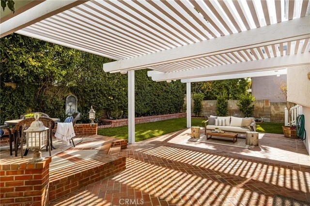 view of patio / terrace with an outdoor living space and a pergola