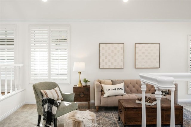 sitting room featuring carpet and ornamental molding