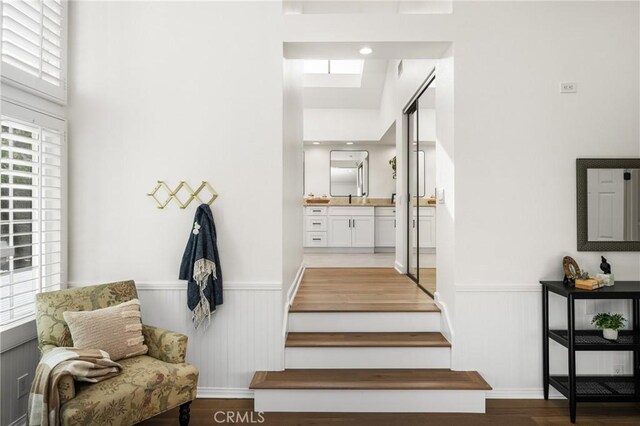 stairs with wood-type flooring