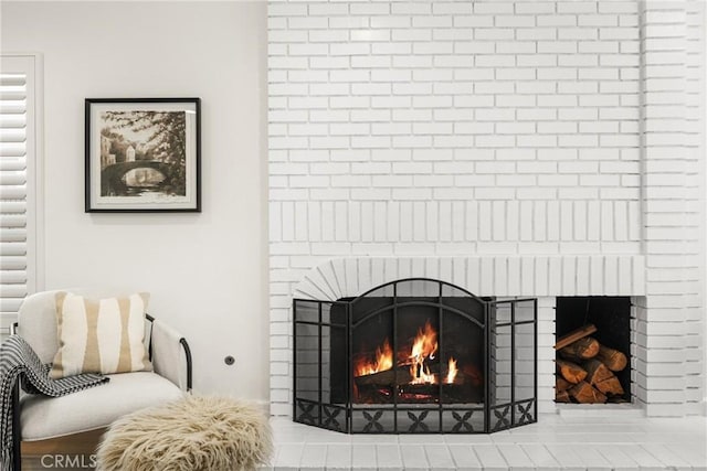 room details featuring a brick fireplace