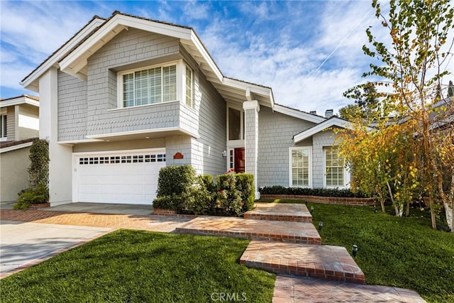 view of property with a front lawn and a garage