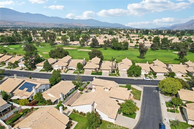 bird's eye view with a residential view, view of golf course, and a mountain view