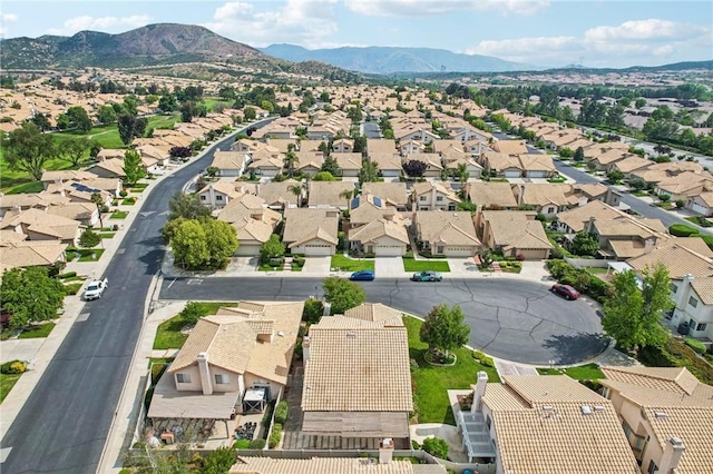 birds eye view of property with a mountain view and a residential view