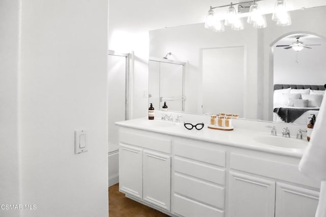 bathroom featuring ceiling fan and vanity