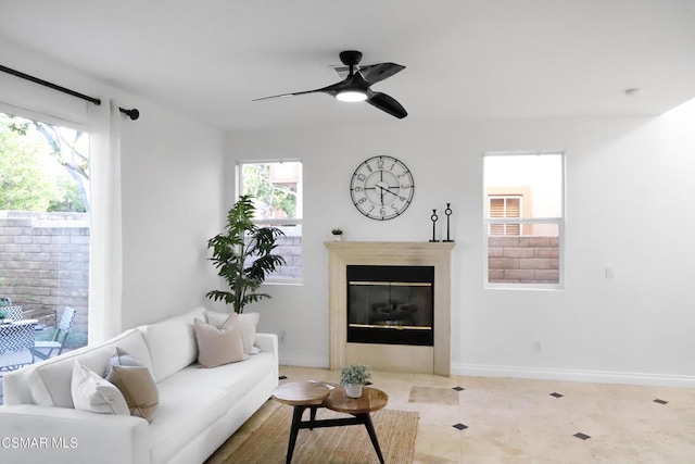 tiled living room with ceiling fan