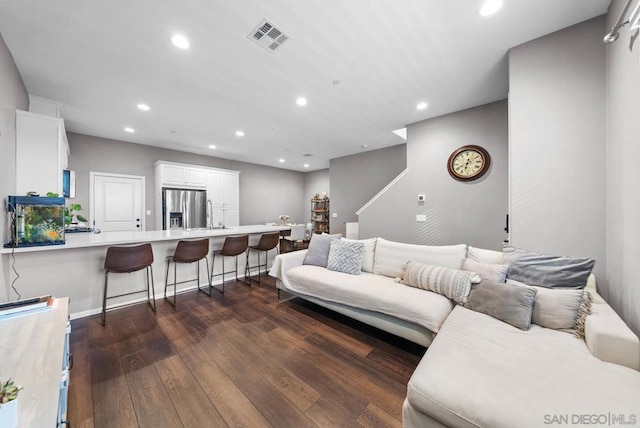 living room featuring dark hardwood / wood-style flooring