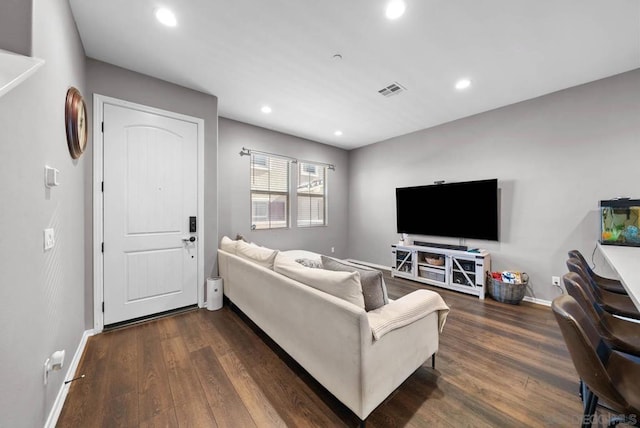 living room featuring dark wood-type flooring