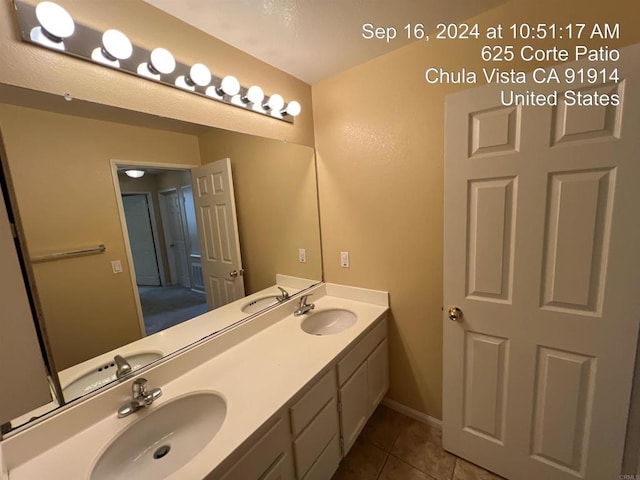 bathroom featuring vanity and tile patterned flooring