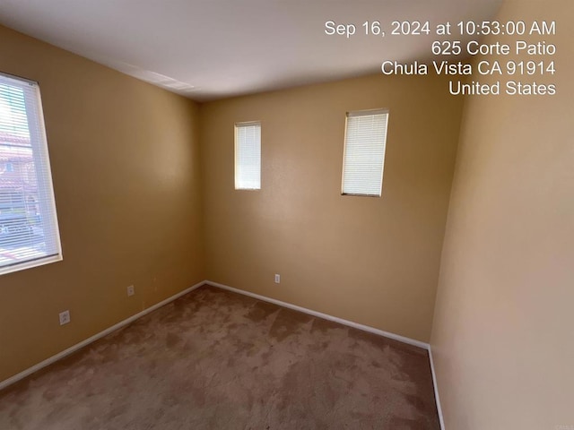 empty room with carpet flooring