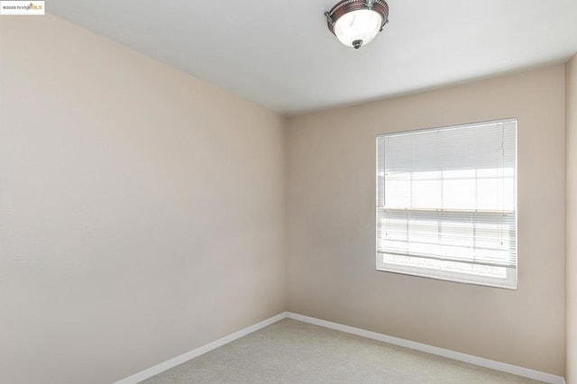 empty room featuring light colored carpet