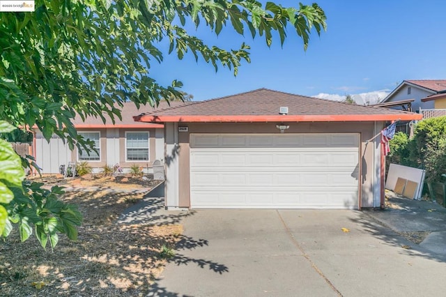 single story home featuring a garage