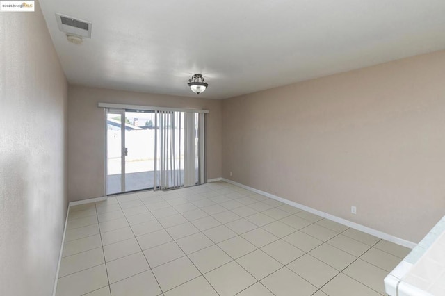 empty room featuring light tile patterned floors