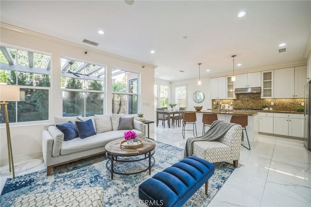 living room with ornamental molding