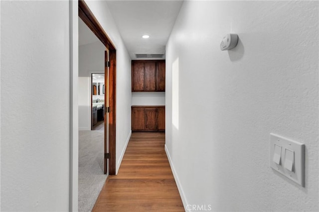 hallway with carpet flooring