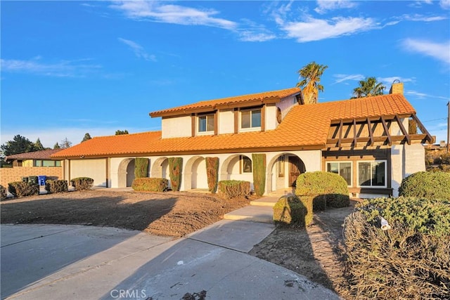 mediterranean / spanish house featuring a garage