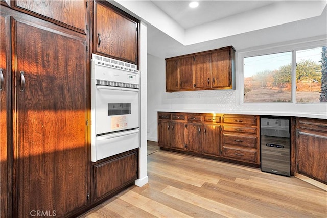 kitchen with light wood-type flooring and white oven