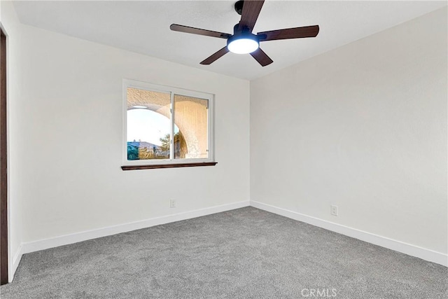 empty room featuring ceiling fan and carpet flooring