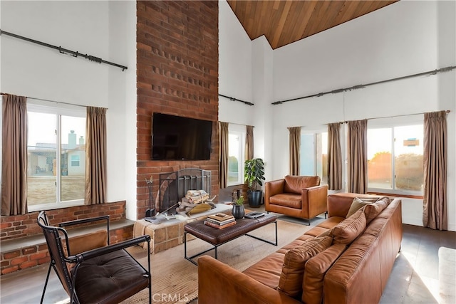 living room featuring a brick fireplace, wooden ceiling, and high vaulted ceiling