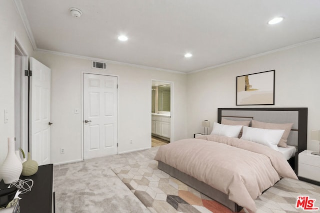 bedroom featuring light colored carpet, connected bathroom, and ornamental molding