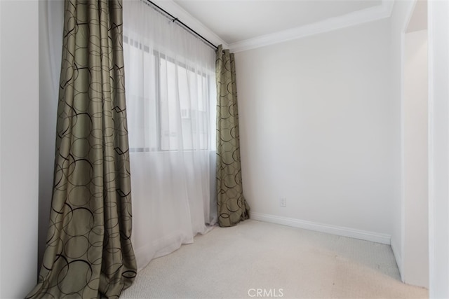 unfurnished room featuring light colored carpet and crown molding