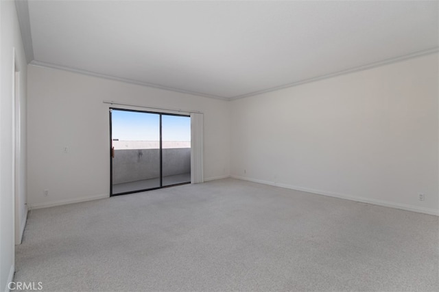 unfurnished room featuring light carpet and ornamental molding