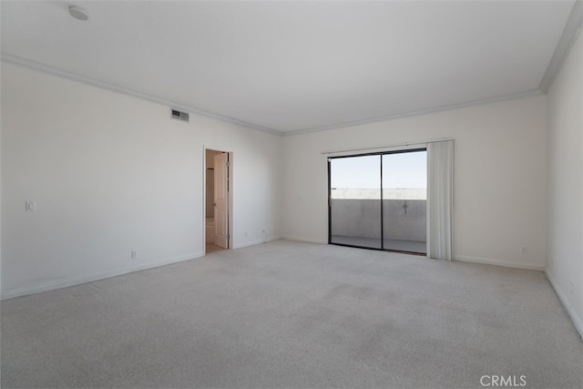 carpeted empty room with crown molding