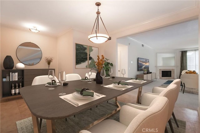 tiled dining space featuring crown molding