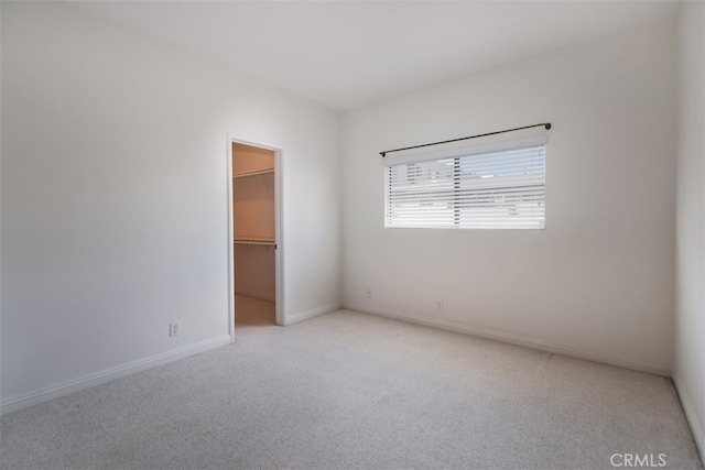 empty room with light colored carpet