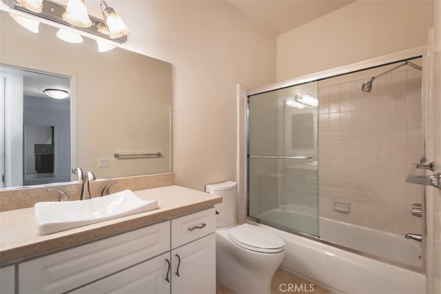 full bathroom with toilet, vanity, tile patterned floors, and shower / bath combination with glass door