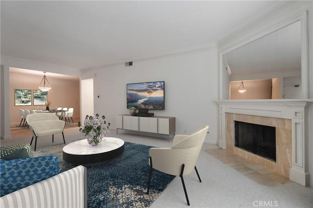 carpeted living room featuring a fireplace and ornamental molding