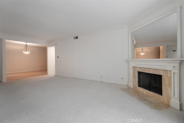 unfurnished living room with light carpet, ornamental molding, and a tile fireplace