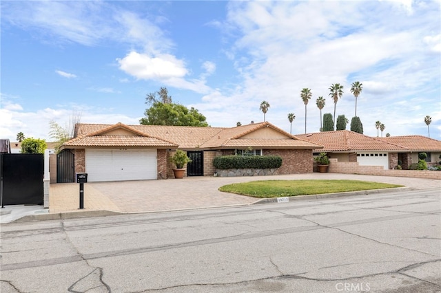 ranch-style home featuring a garage