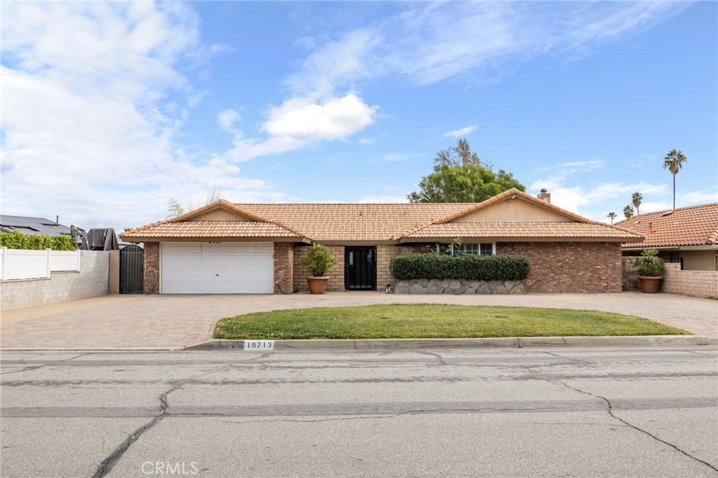 ranch-style home with a garage